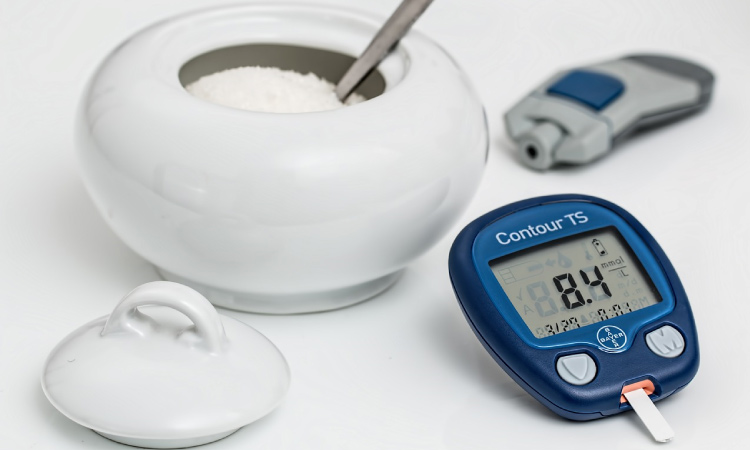 sugar bowl and blood sugar monitor