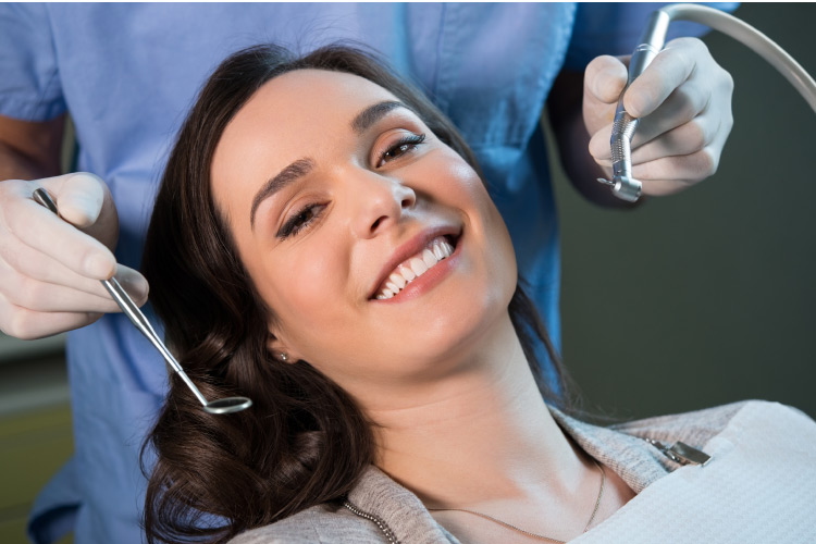 woman at a dental appointment to get amalgam fillings changed